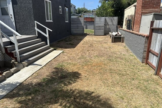 The back yard as it was on the Saturday walkthrough, photographed on a phone